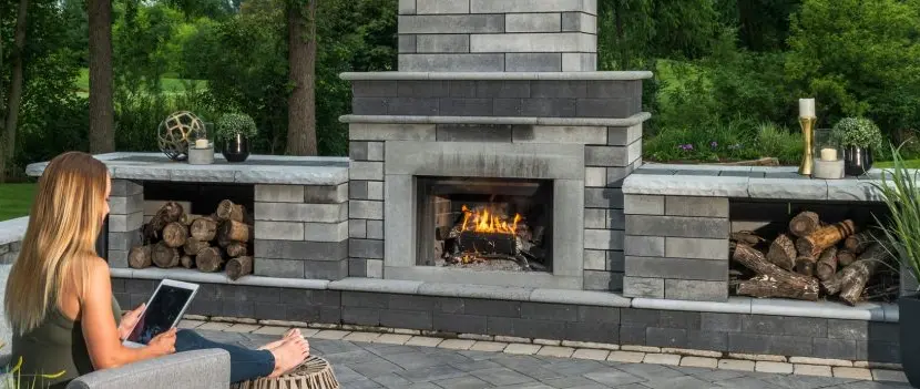 Outdoor fireplace on a pavilion in Huron, OH, with furniture.