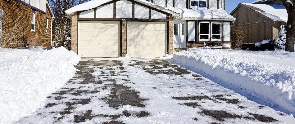 House in Huron, OH, with a snow-cleared driveway.