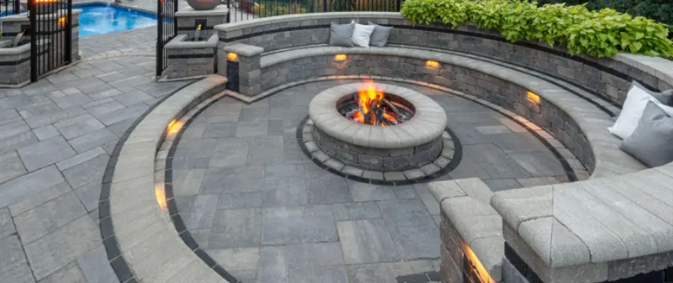 Seating wall around a wood-burning fire pit in Huron, OH.