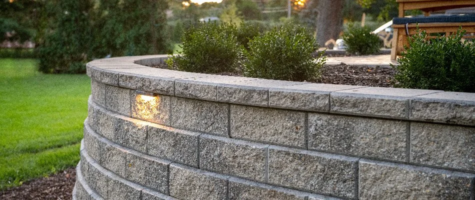 Block retaining wall with a planter bed in Huron, OH.