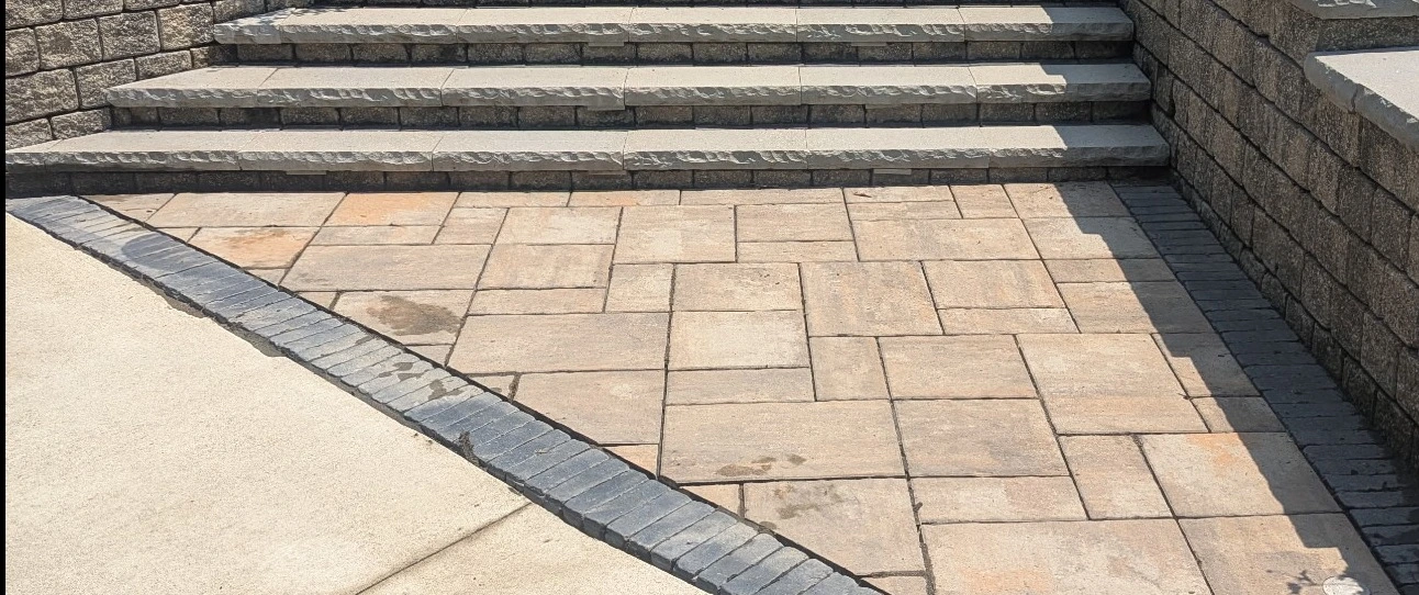 Paver patio in Huron, OH, at the back of a house.