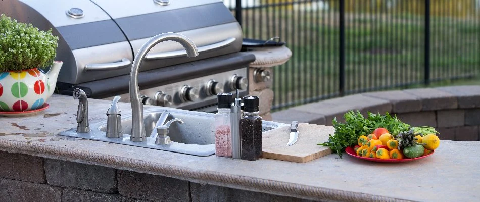 Fresh produce beside an outdoor kitchen sink in Huron, OH.