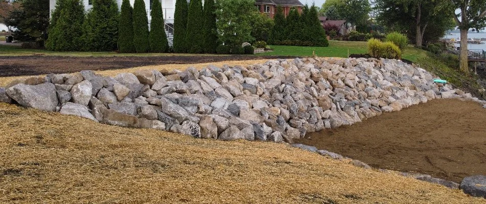 Granite boulder retaining wall in Huron, OH.