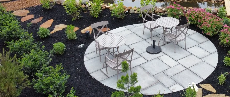 Mulched landscape around a paver patio in Huron, OH.