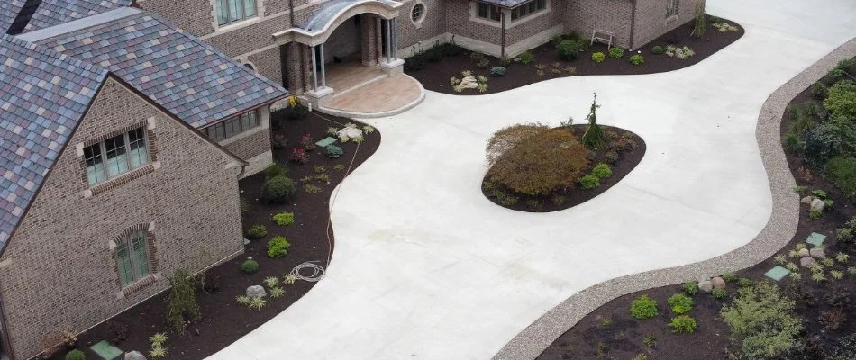 Mulched landscapes around a large driveway in Clyde, OH.