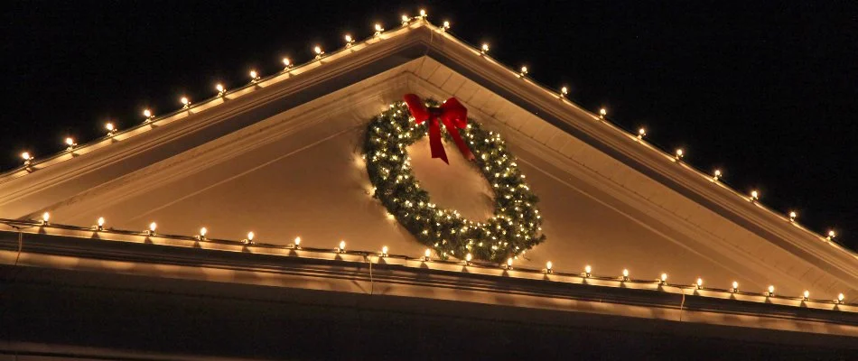 Warm white Christmas lights and a wreath in Fremont, OH.